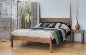 Ethnic bedroom style, the exotic solid wooden Togo bed and bedside table in walnut wood