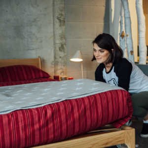 Beth dresses our solid oak Carnaby bed