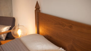 A closer view of the walnut Samarkand Indian-style bed headboard