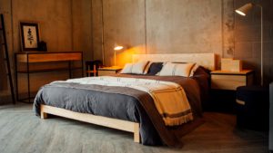 low wooden sonora bed in ash with slate-linen-bedding for a Nordic look