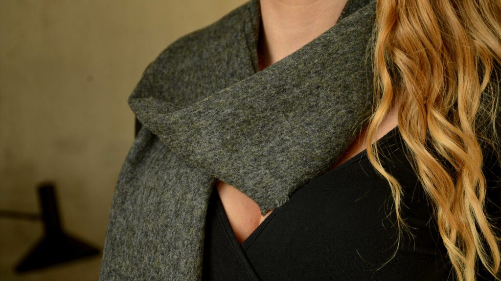 wool scarf in olive green shown close up