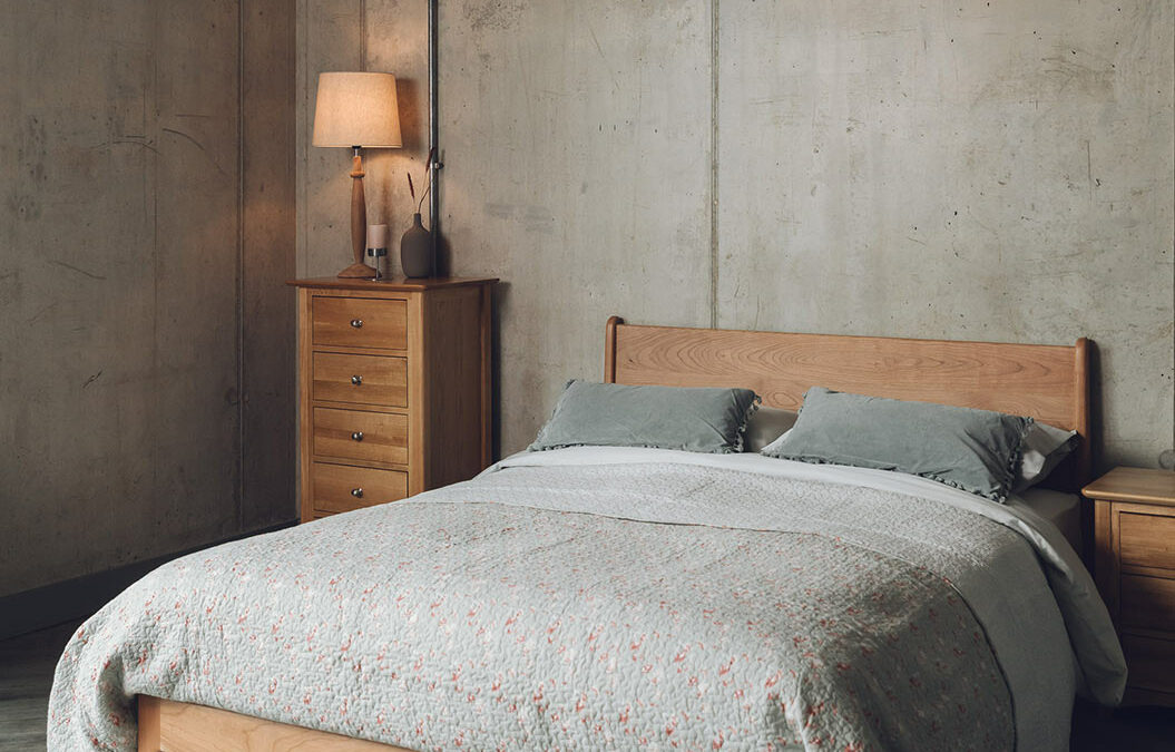 contemporary cottage look bedroom with floral quilted bedspread on a cherry Camden bed
