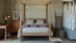 Our Raj bed is an Indian inspired wooden 4 poster with hand carved details.