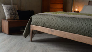 A closer view of the wooden Hoxton Bed leg made from Walnut wood.