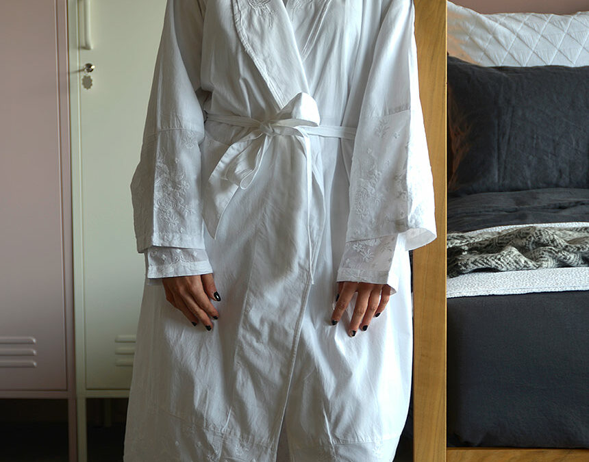 traditional white cotton dressing gown with embroidered lapels cuffs and hems
