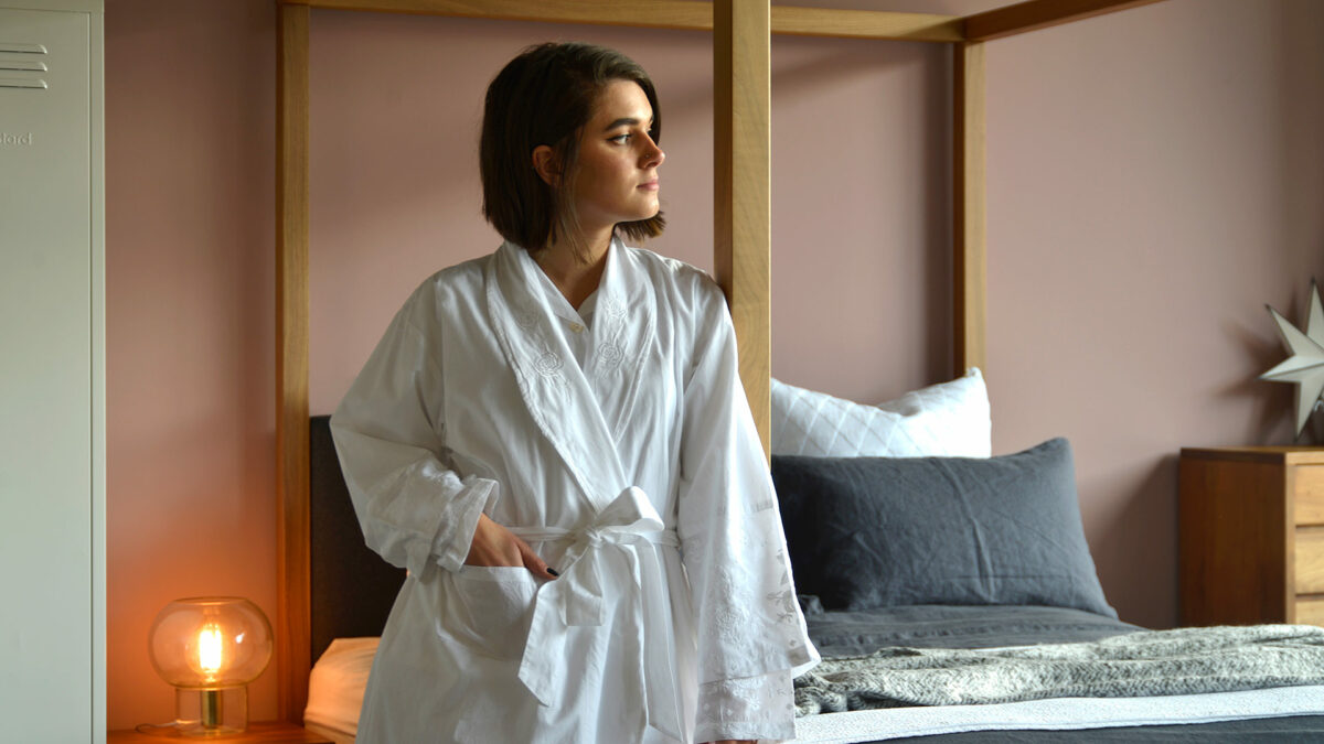 traditional white cotton dressing gown with embroidered lapels cuffs and hems