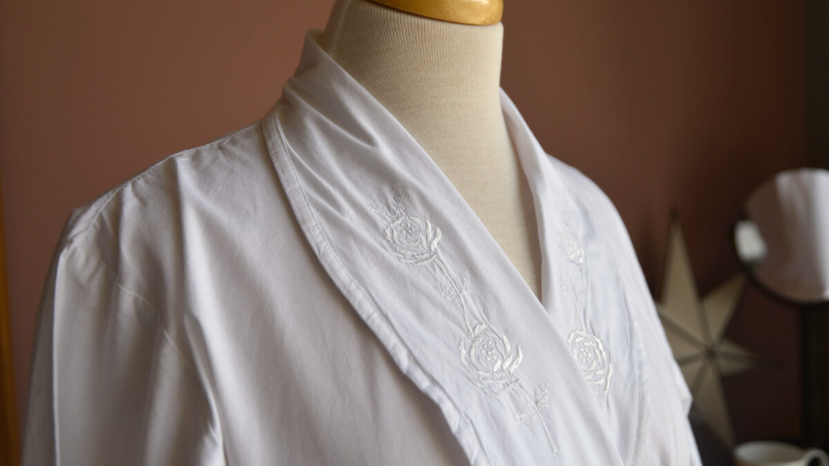 traditional white cotton dressing gown with rose embroidered lapels